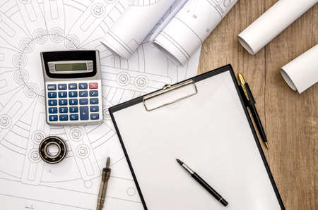 engineering drawing with a tool on the tableの写真素材