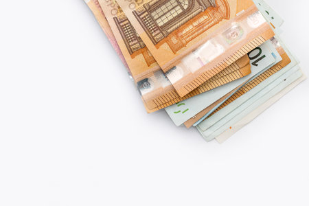 Pile of euro banknotes isolated on white background