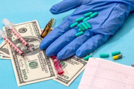 cardiogram with dollar, peills and syringeの写真素材