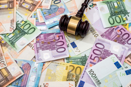 Judge hammer on euro billsの写真素材