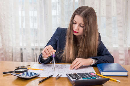 Architect measure and calculate architecture drawing, close upの写真素材