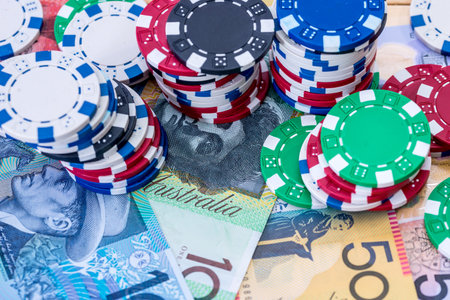 Colorful casino chips on australian dollars closeupの写真素材