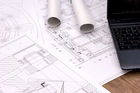 Engineering drawings of parts with a laptopの写真素材