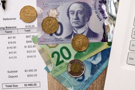 Canadian dollar with business diagram pen and calcualtorの写真素材
