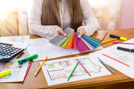 Designer showing color swatch, choose color for renovationの写真素材