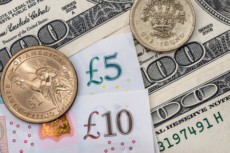 dollar and pound - banknotes and coin.の写真素材