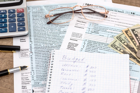 Calculator and pen with 1040 tax formの写真素材