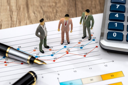 mini people with a graphic and a calculator