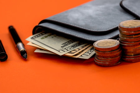 a dollar purse, a coin penの写真素材