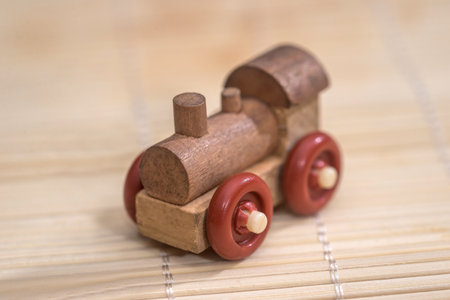 Old vintage wooden toy train on wooden backgroundの写真素材