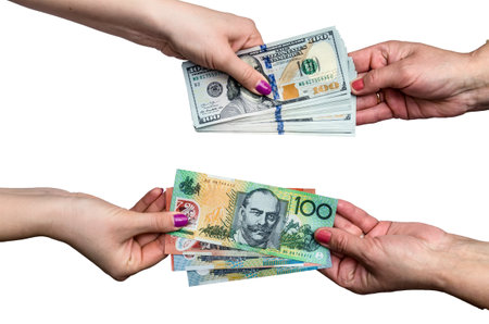 Exchanging money between american dollar and Australian dollar isolate on whiteの写真素材