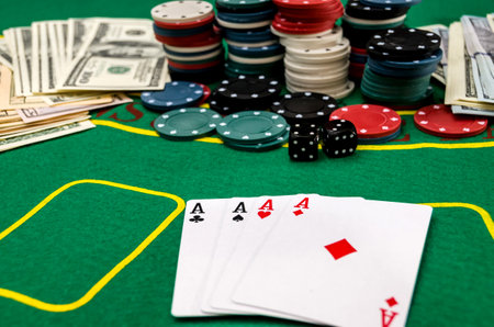 cards, chips and money on the poker table