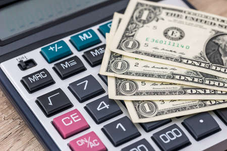 american dollar with calculator - tax concept