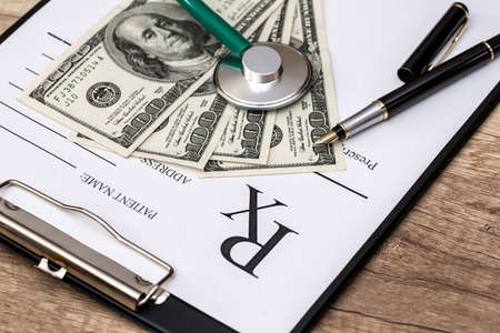 medicine concept - rx, dollar, stethoscope and pills