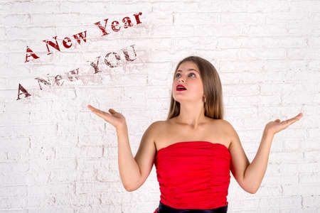 Girl in red dress waiting for new 2019 yearの写真素材