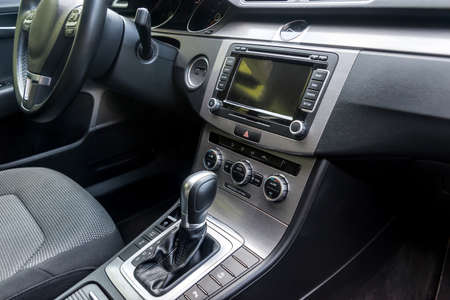 Car interior with automatic transmission lever, closeup