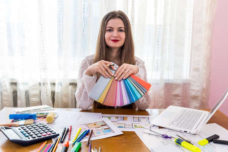 Designer woman working with color samples, workplaceの写真素材