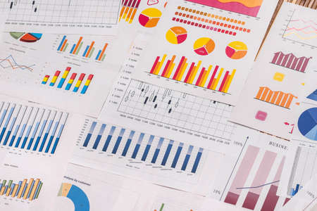 Different business graphs and diagrams used as background