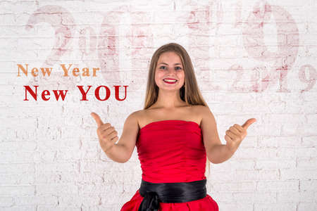 Girl in red dress waiting for new 2019 year