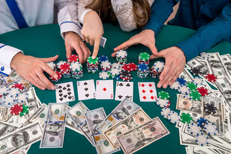 Company of friends making bet in casino, gambling