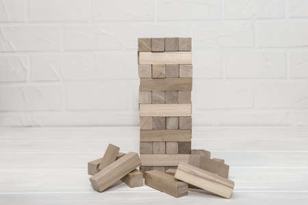 Wooden blocks in tower situated at table