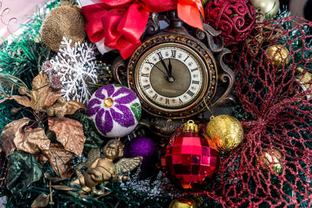 Vintage clock with new year decorations and gift boxes