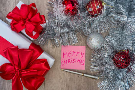 Top view of christmas presents with decorations on tableの写真素材