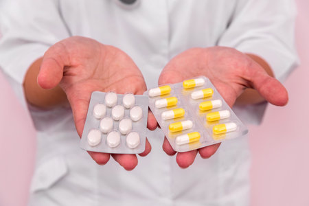Female palms with pills in blisters closeupの写真素材