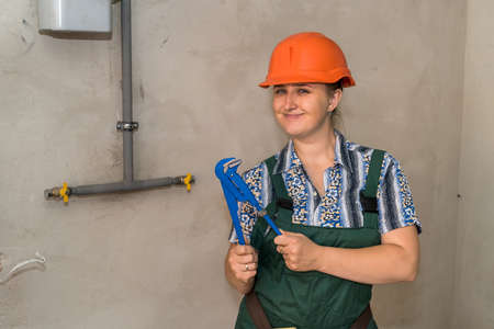 Woman engineer with tool belt and adjustable keyの写真素材