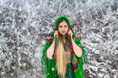 Woman with long hair and shawl in park