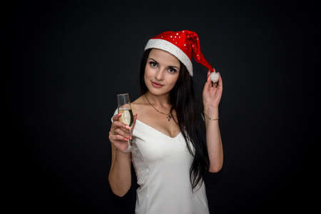 Attractive brunette woman with glass of champagneの写真素材