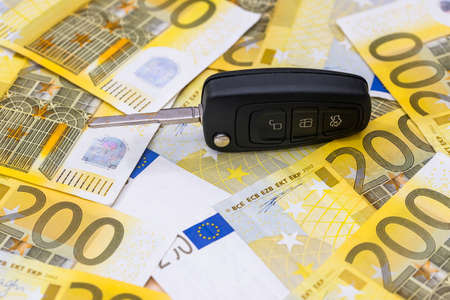 Remote car control on euro banknotes backgroundの写真素材