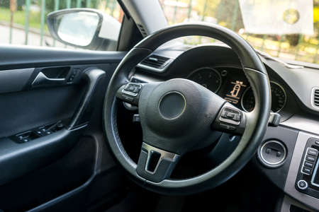 Closeup on car steering wheel, salon designの写真素材