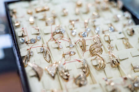 Showcase in jewelery shop with golden jewelsの写真素材