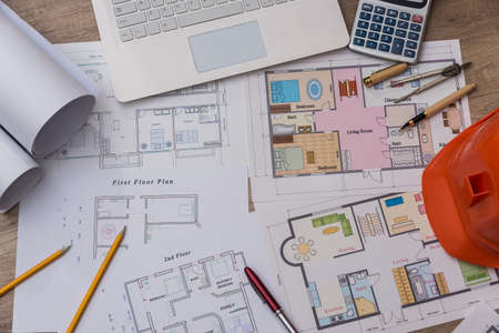 Architect's workspace with new project and laptop