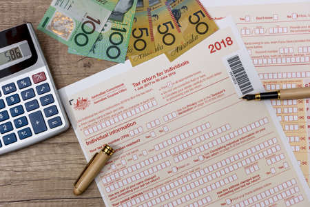 Australian dollars with calculator and tax formの写真素材