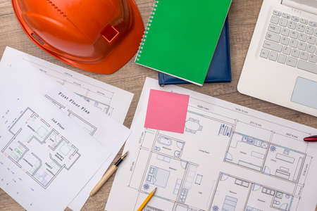 Architect's workplace on wooden table with new project