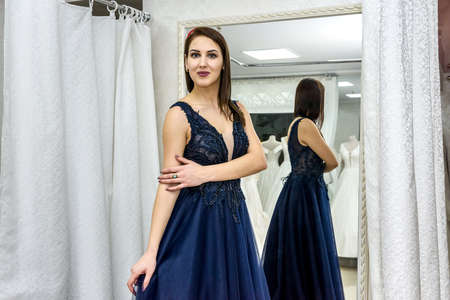 Fashion model in dark dress, elegant woman in salonの写真素材