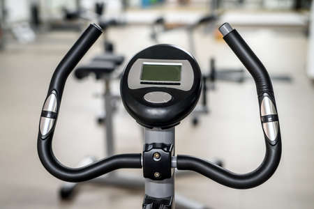 Two exercise bikes in the gym.の写真素材