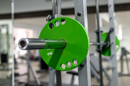 Different color weights for barbells in gym