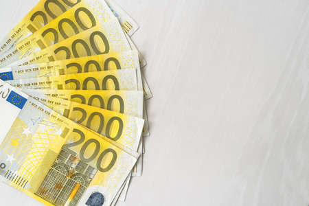 200 euro banknotes in fan on wooden tableの写真素材