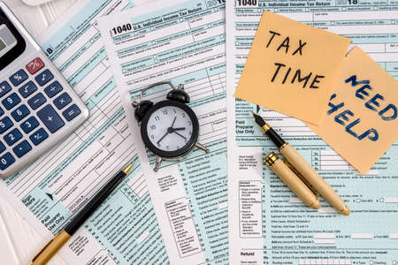 1040 form with colorful stickers on the tableの写真素材