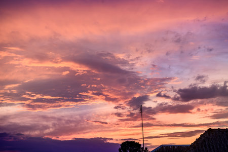 Clouds on sky in pink colors, sunset or sunriseの写真素材