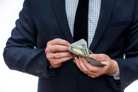 Dollar banknotes in male hands close upの写真素材