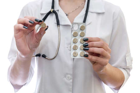 Doctor holding pill and blister isolated on whiteの写真素材