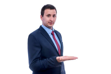 Young man in suit gesturing isolated on whiteの写真素材