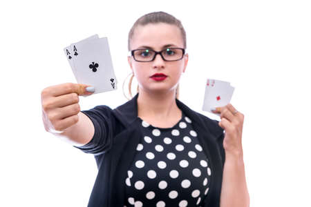 Woman with four aces isolated on whiteの写真素材