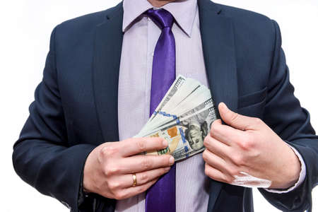 Male hands with dollar banknotes in pocketの写真素材