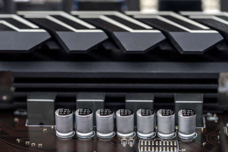 Selective focus on details on motherboard of personal computer