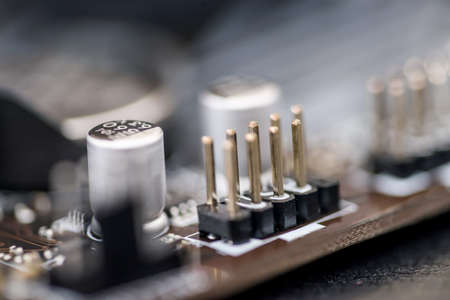 Selective focus on details on motherboard of personal computer